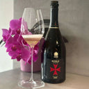 Lanson Noble Cuvee 2005 Champagne bottle with pink orchids and a filled glass.