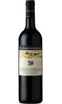 Podere Poggio Scalette Il Carbonaione 2010 wine bottle with label featuring vineyard illustration.