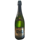 Bottle of Bollinger R.D. 1979 Extra Brut Champagne with vintage label on green glass.